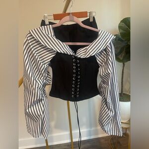 Corset top with oversized pinstriped sleeves and mini shorts